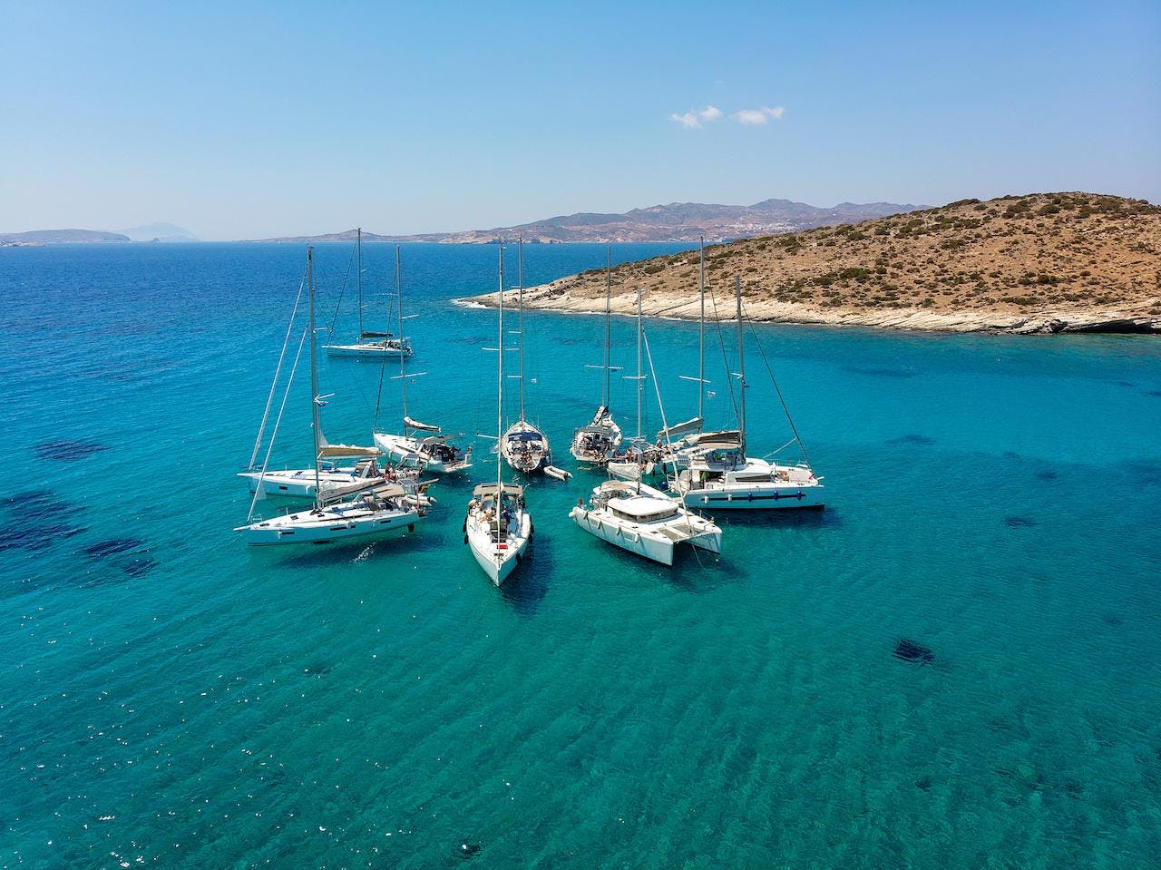 Yachts and cats rafted up cyclades