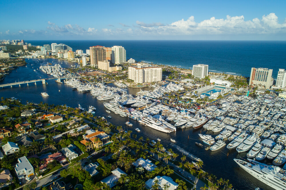 The Best Places for Sailing in the US: 8 Amazing Holiday Destinations 6 This picture shows the big marina of Fort Lauderdale with boats mooring side by side and showing the skyline and the blue water as well