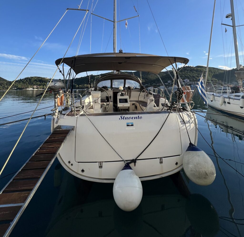 Sailboat moored in city harbour